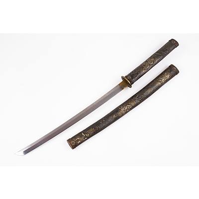 Japanese Samurai Style Wakizashi Curved Blade with Brass Habaki Pierced Brass Tsuba, Embossed and Engraved Grip and Scabbard Adorned with Scenes of Japanese Warriors.