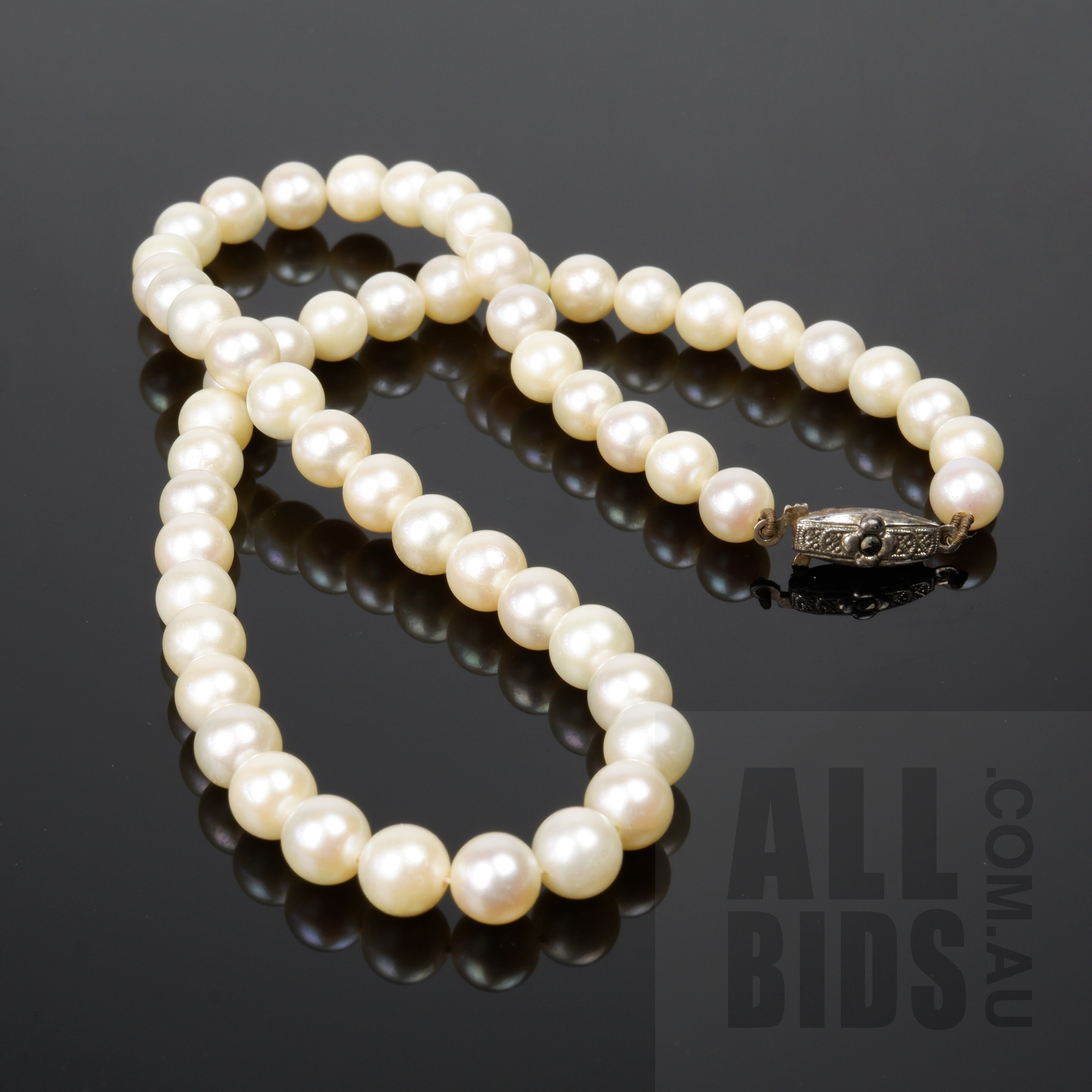 'Strand of Round Akoya Type Pearls with Sterling Silver Clasp'