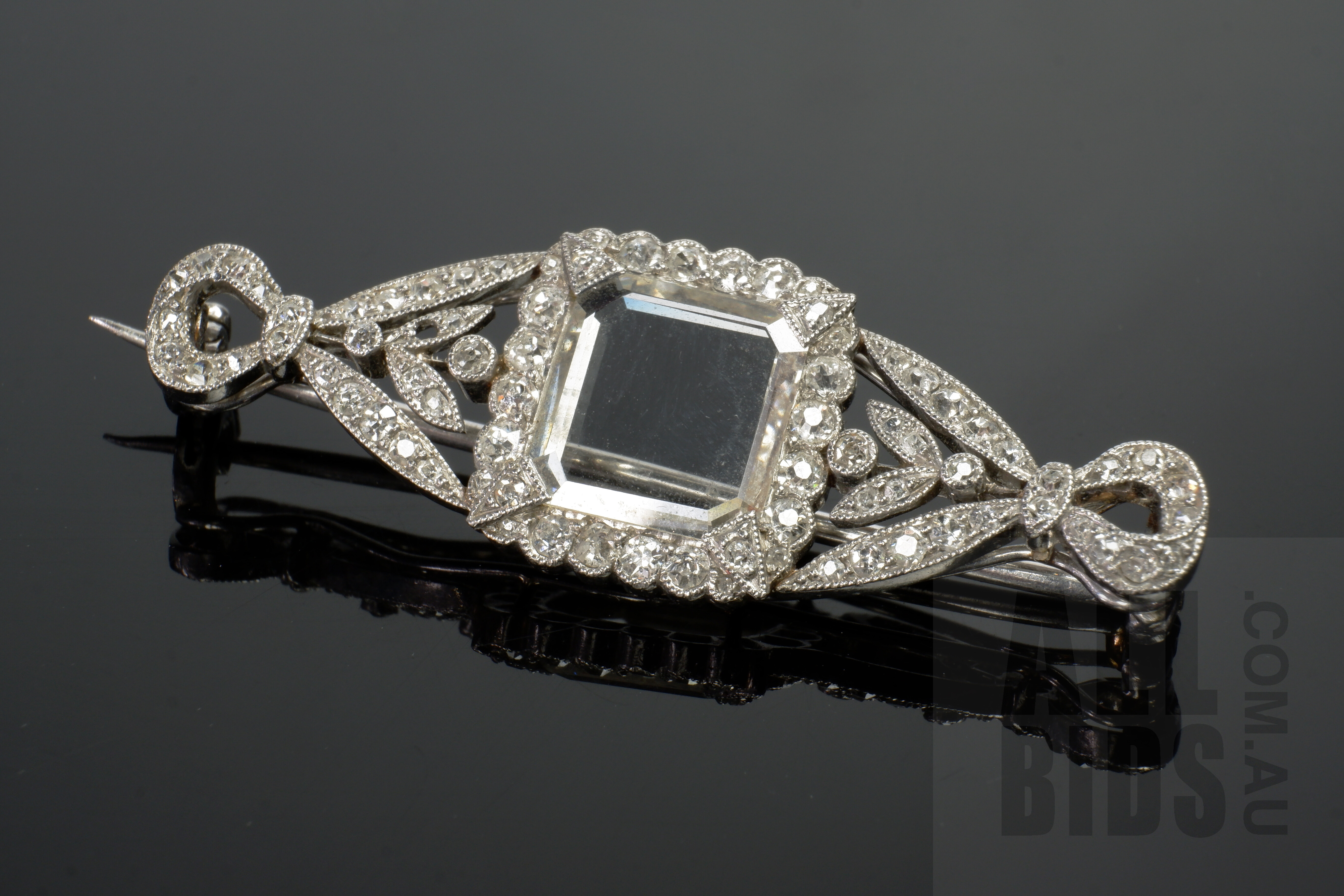 'Good Antique Art Deco Bow Brooch in Platinum with Old Mine Cut Diamonds and Emerald Shaped Flat Rock Crystal, 6.9g'