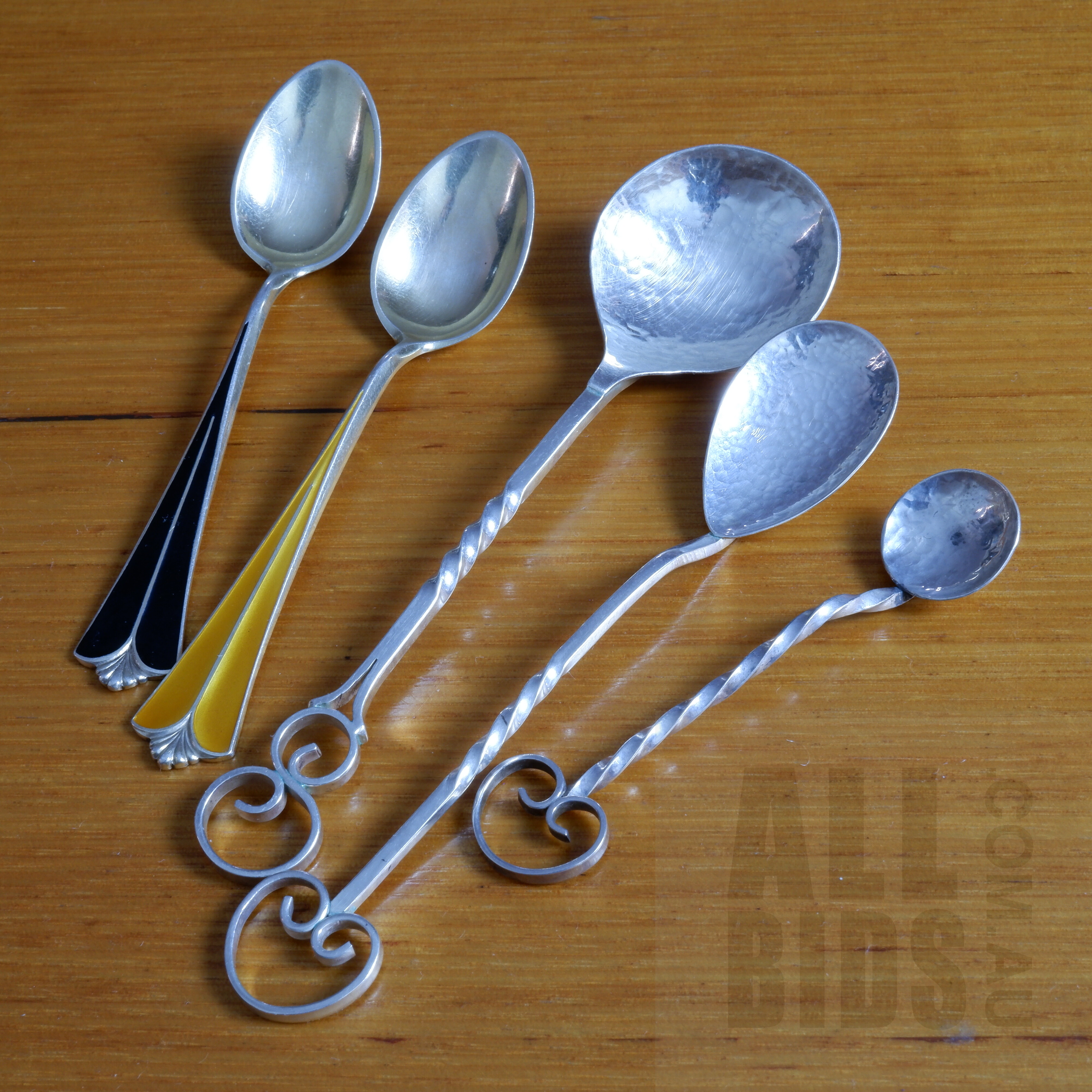 'Three Sterling Silver Sugar Spoons in the Manner of Sargisons, Tasmania, 26g with Two David Anderson Norway Sterling Silver and Enamel Teaspoons, 19h'