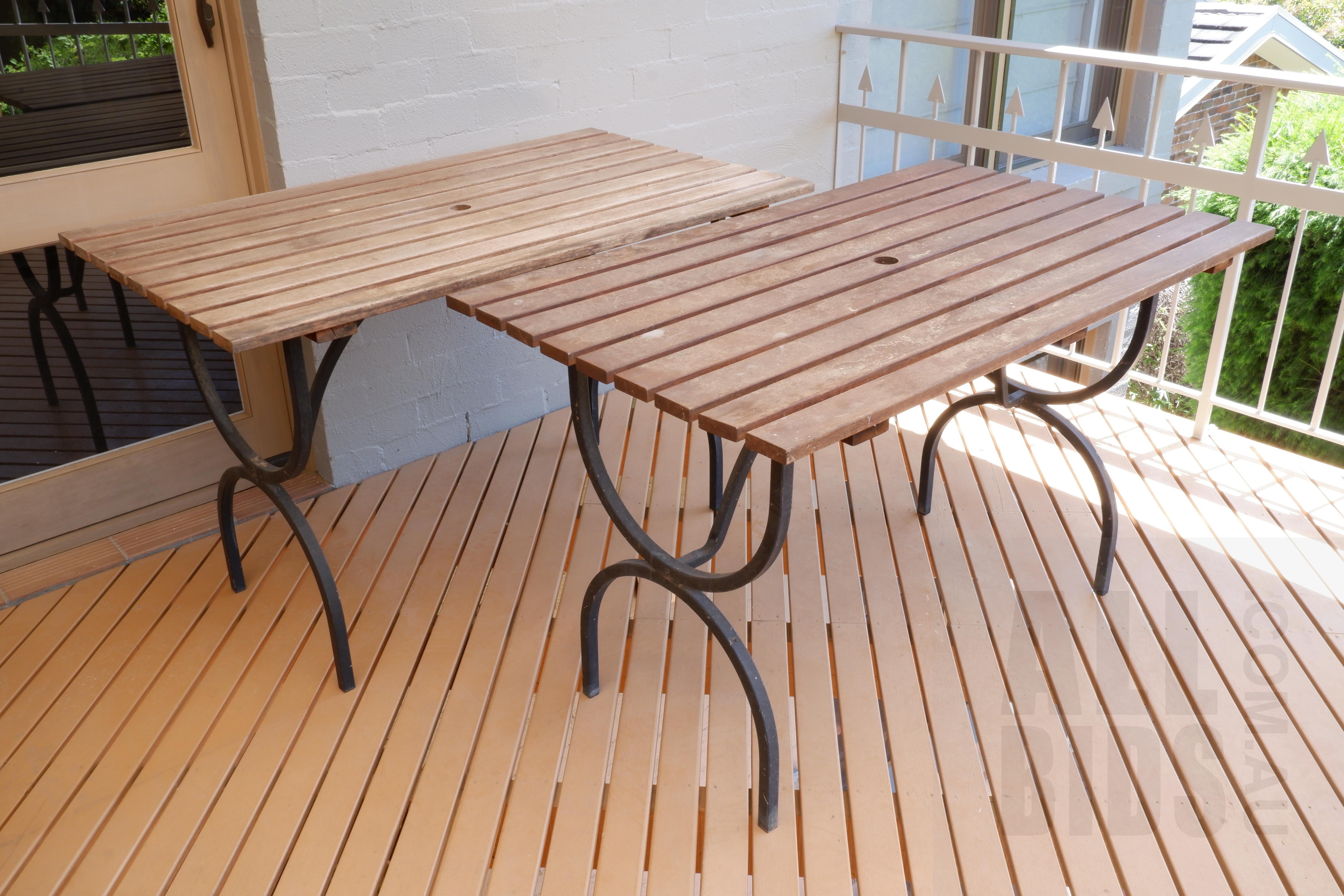 'Pair of Bespoke Wrought Metal and Hardwood Outdoor Tables'