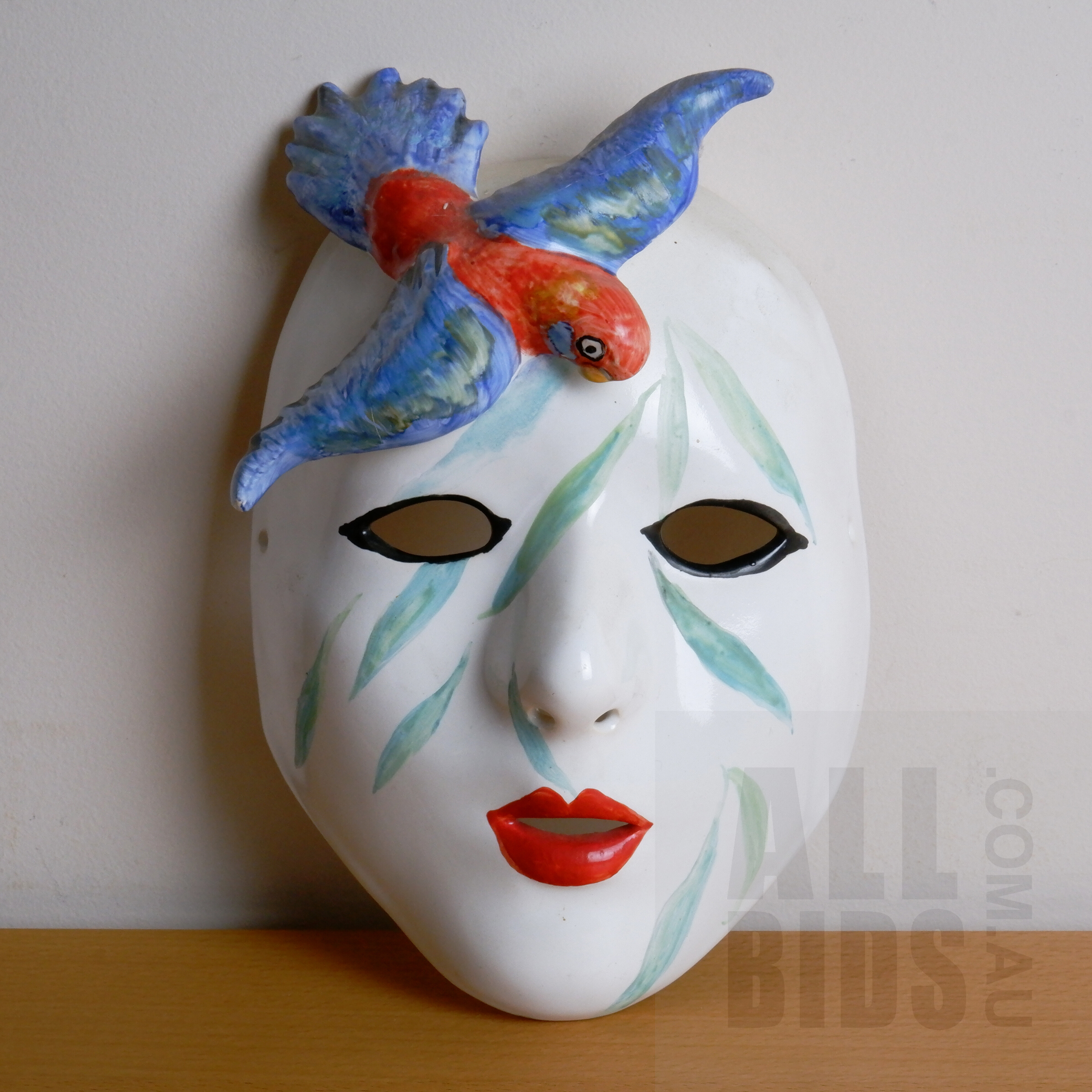 'Attributed to Barbara Swarbrick (England/ Australia 1945-) Painted Porcelain Mask with Rosella'