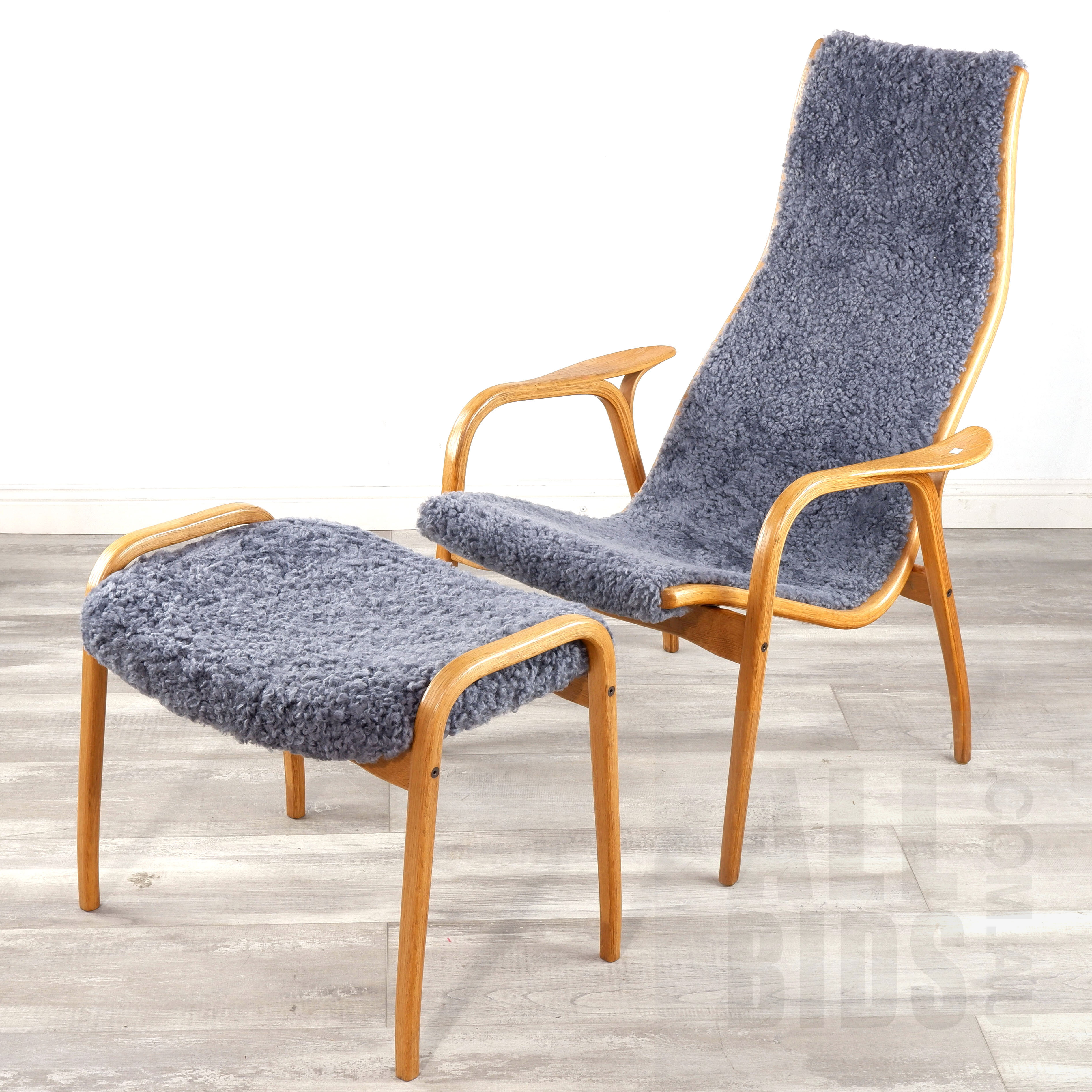 'Yngve Ekstrom (Sweden 1913-1988) Lamino Oak Lounge Chair and Footstool with Sheepskin Upholstery'
