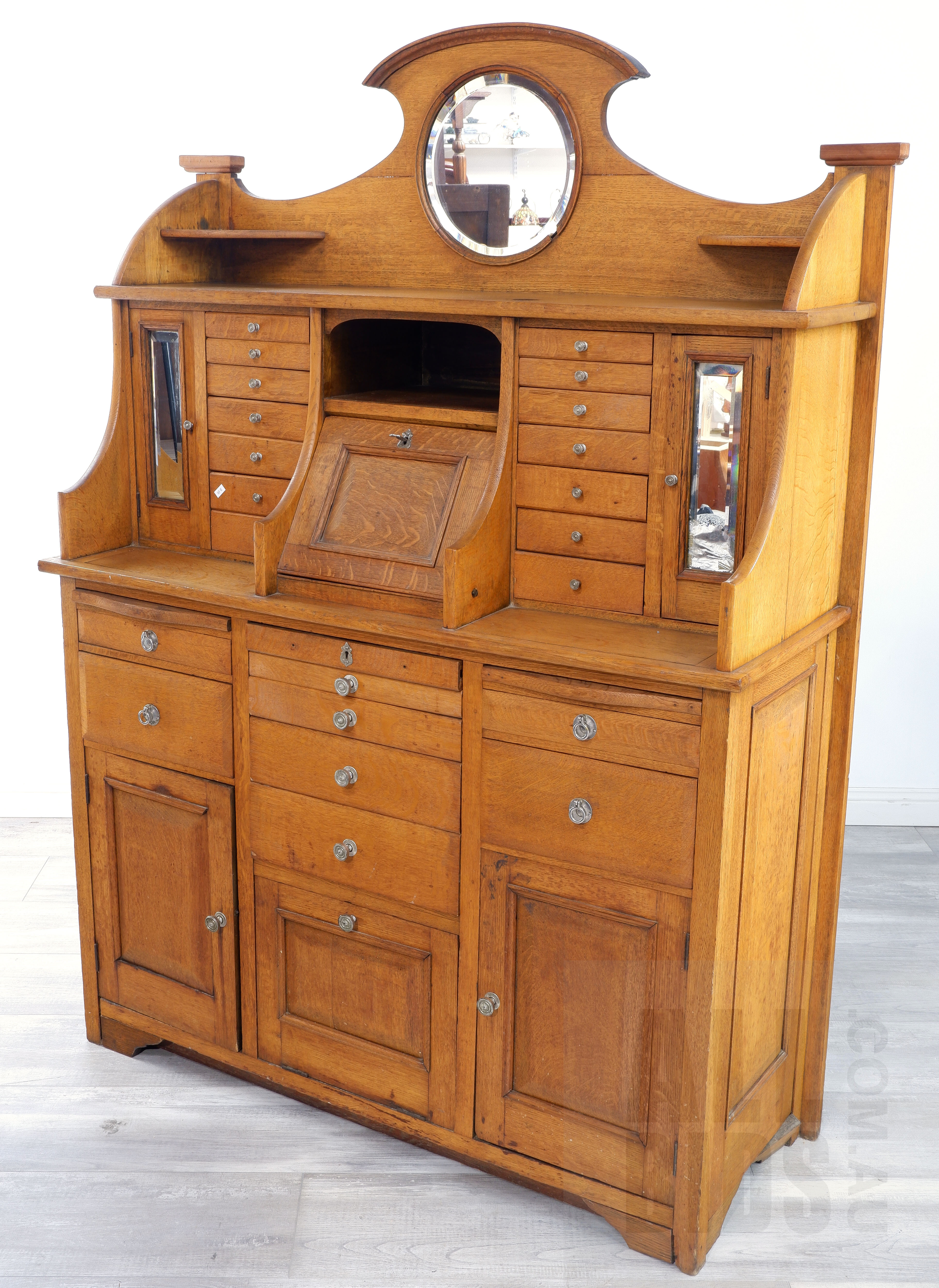 'Early 20th Century Oak Dentist Cabinet with Custom Tool Drawers, Beveled Glass Mirrors and Metal Lined Drawer'